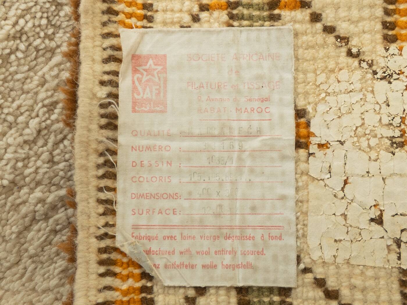 XXL Berber rug with long fringes from the 1960s. Cream-coloured pile with patterns in orange and green tones.