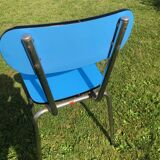 Two blue chairs in formica