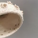 Ceramic hanging lamp in creamy white color that almost looks like a corral