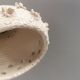 Ceramic hanging lamp in creamy white color that almost looks like a corral