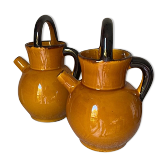 Enameled jugs signed Gomares