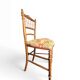 Two floral upholstered music chairs from the early 20th century.