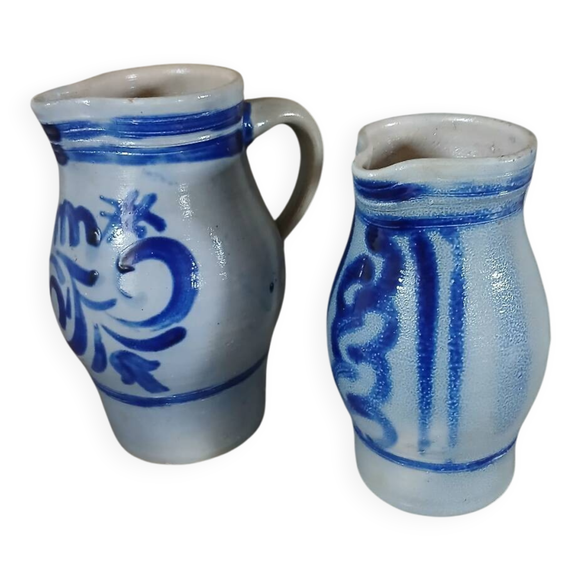 2 antique stoneware pitchers