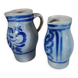 2 antique stoneware pitchers