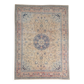 Antique Turkish wool rug in faded floral patterns, 10 x 13 feet.