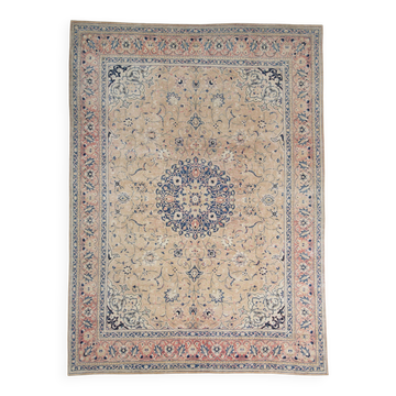Antique Turkish wool rug in faded floral patterns, 10 x 13 feet.