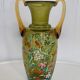 Enamelled green glass vase