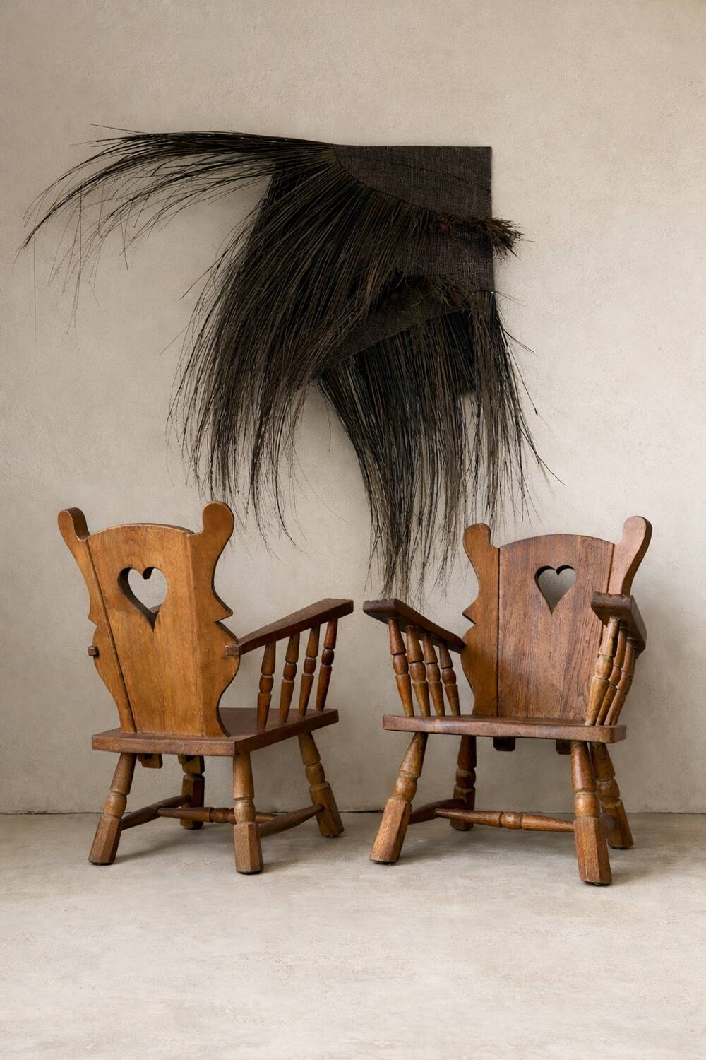 Pair of rustic oak armchairs – carved heart backrests