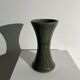 Dark green handcrafted vase with glazed ceramic grass blades