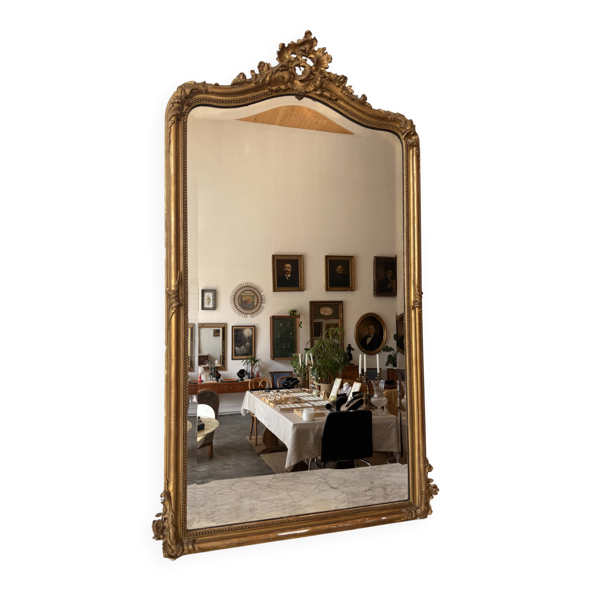 Large antique Louis XV style mirror in gilded wood.