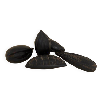 Set of decorative fruits in carved blackened wood.