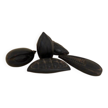 Set of decorative fruits in carved blackened wood.