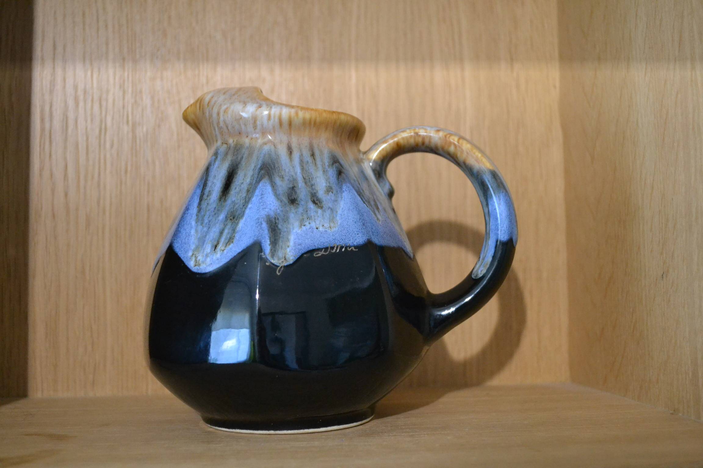 Blue flamed stoneware jug