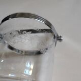 Clear glass ice bucket with an etched floral design