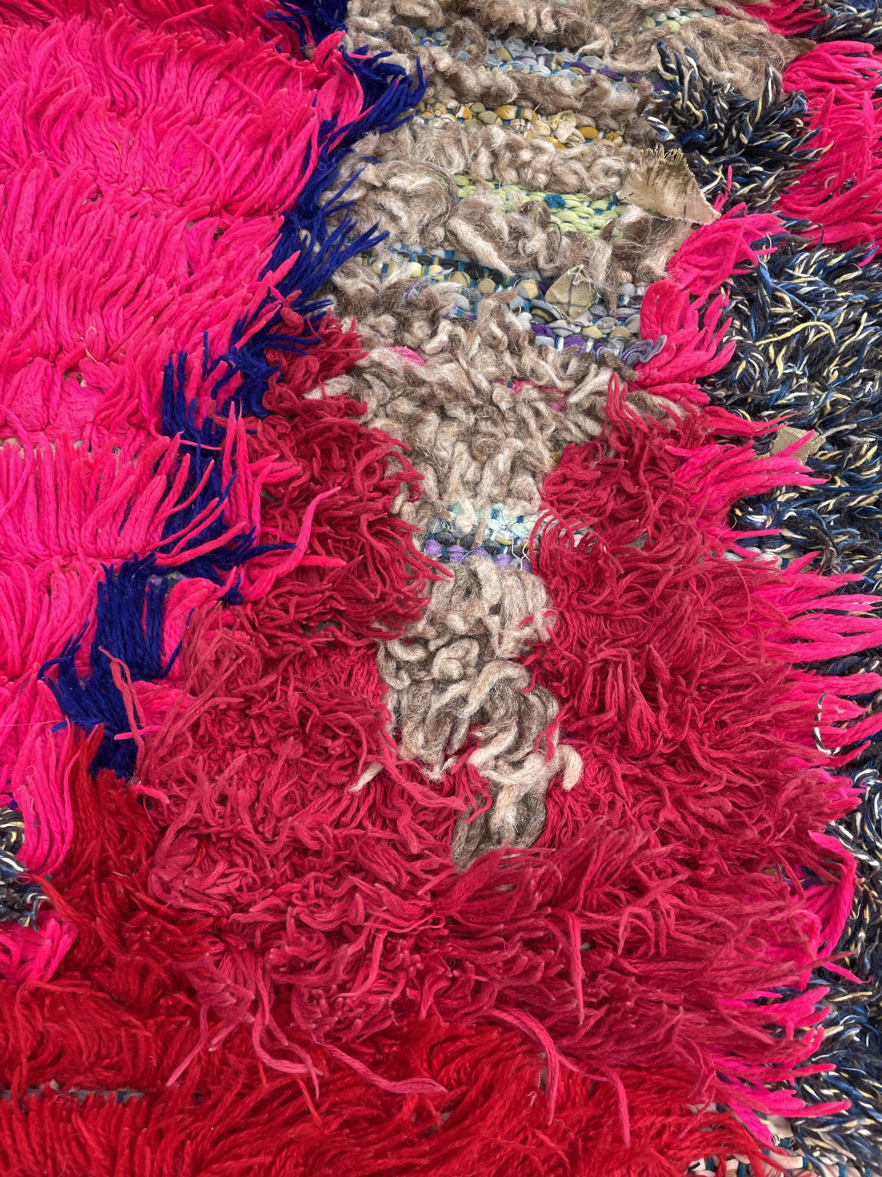 Modern red berber carpet in boucherouite fabrics