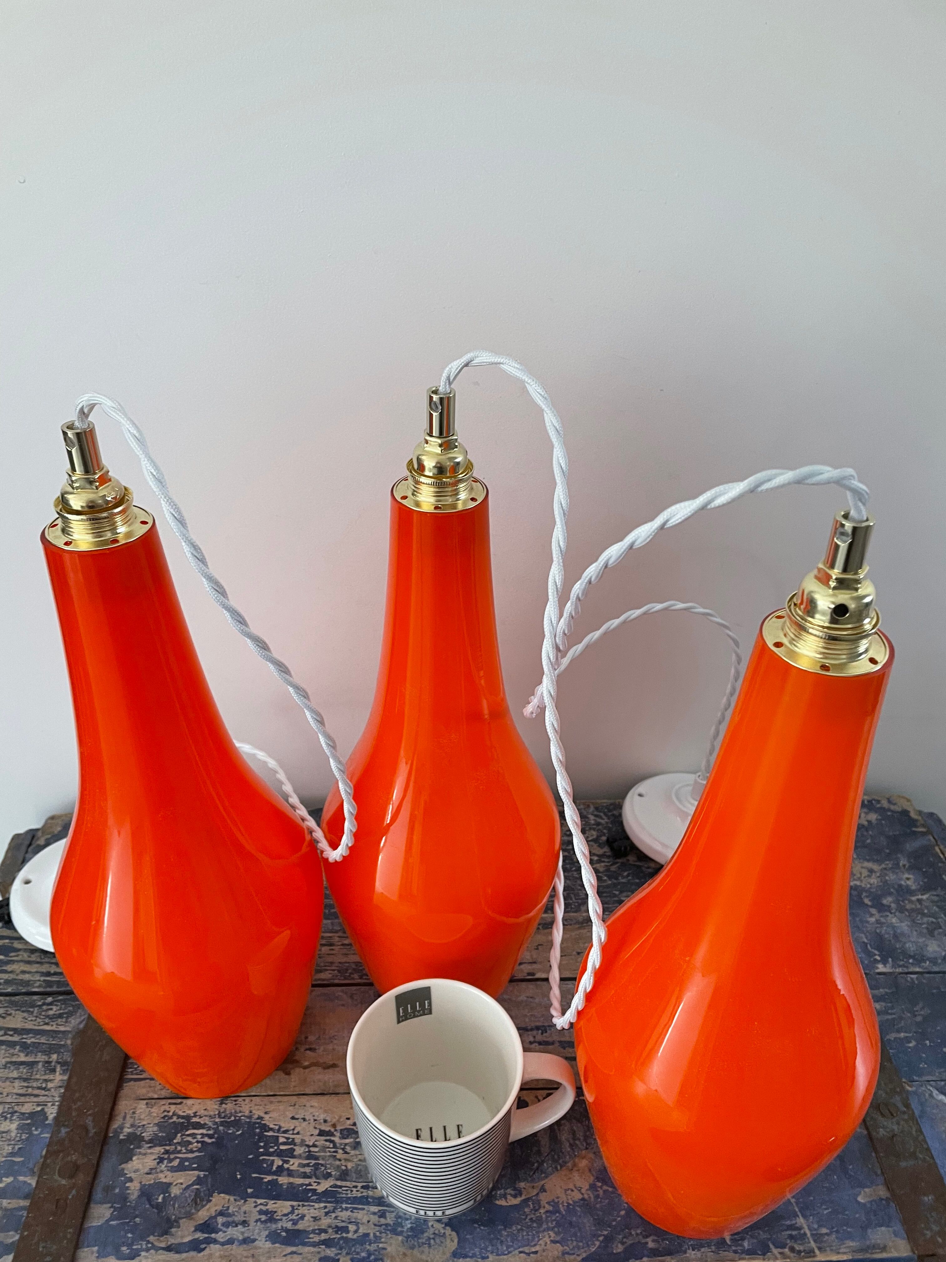 Set of three new electrified orange vintage pendant lamps