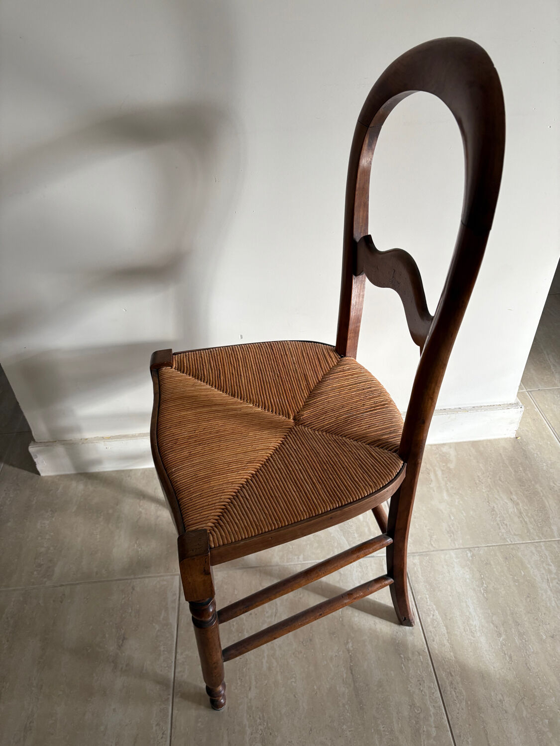 Antique wooden chair with woven straw seat – rustic style
