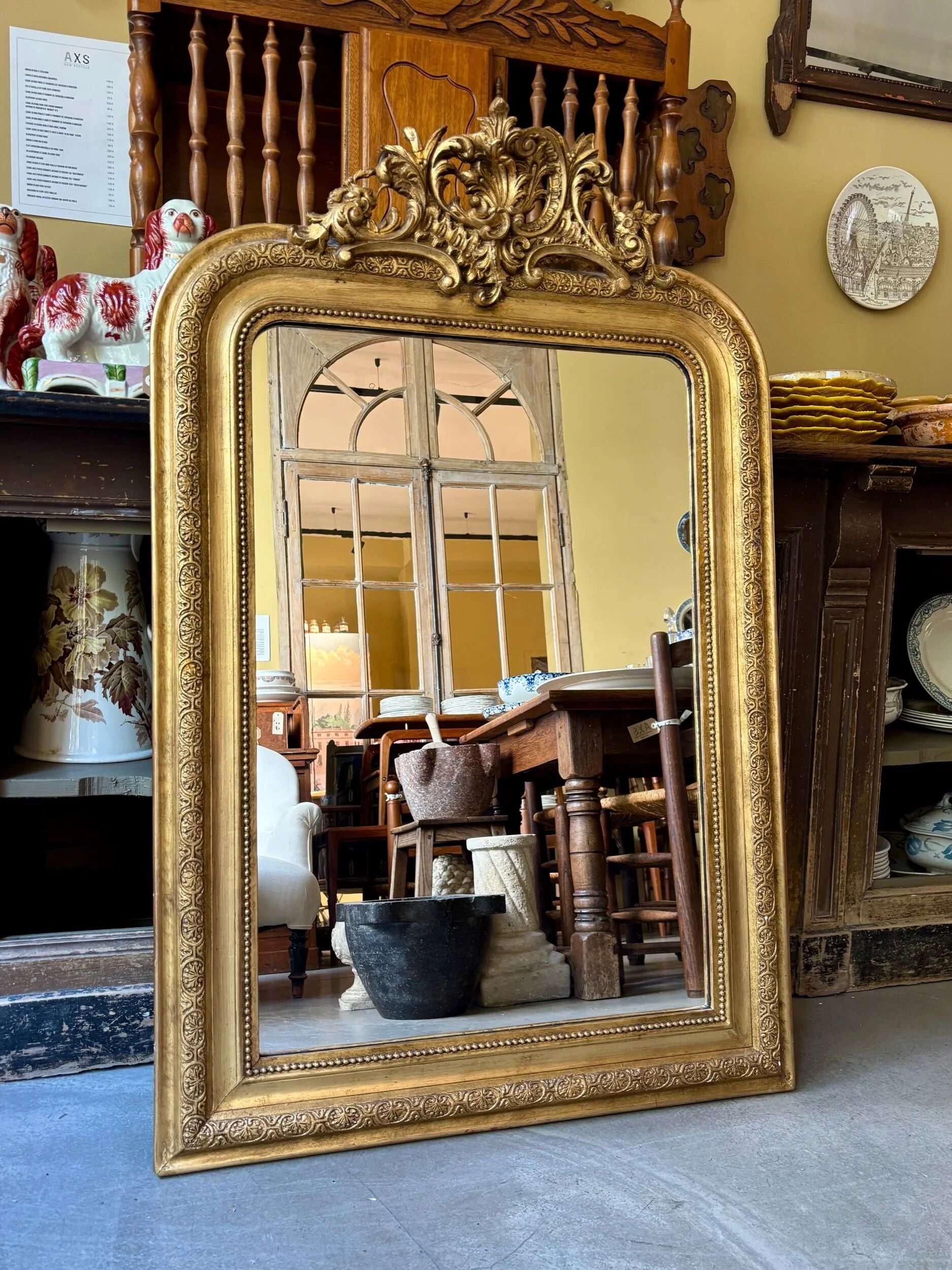 Gold sculpted and moulded stucco trumeau mirror 113 x 78 cm