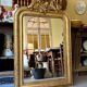 Gold sculpted and moulded stucco trumeau mirror 113 x 78 cm