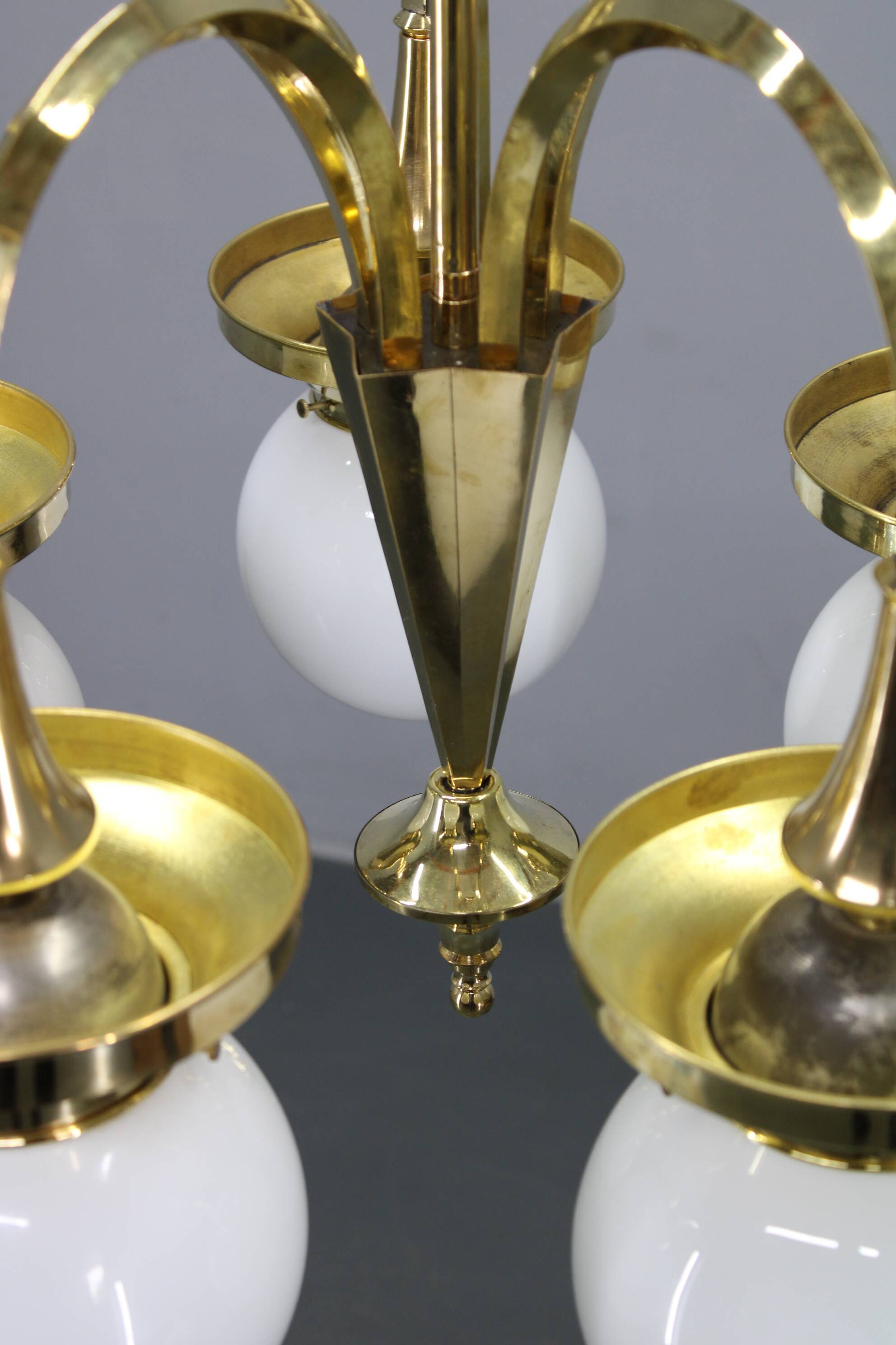 1930s Czechoslovak Art Deco brass chandelier with five opaline glass globes