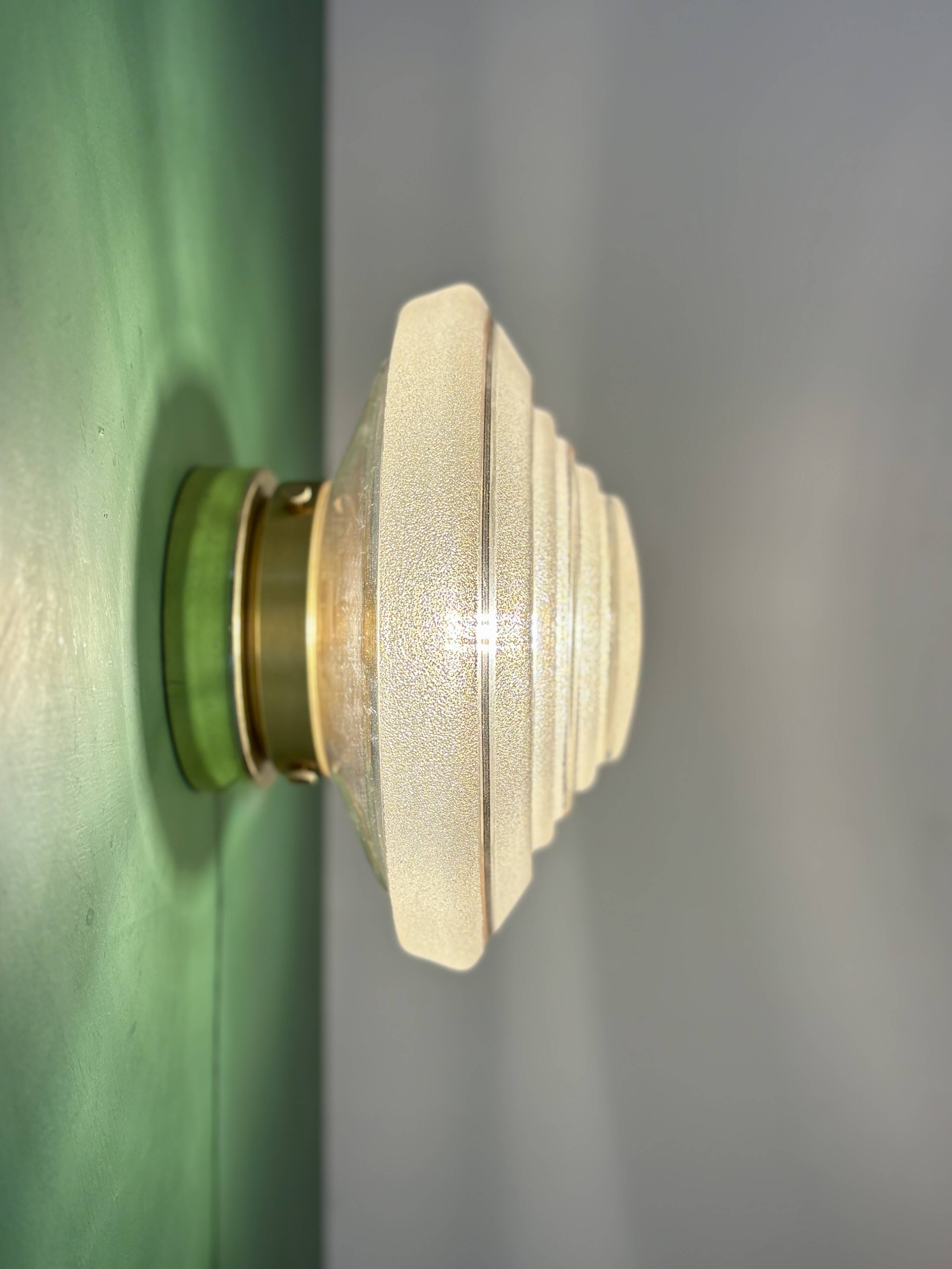 Old glass globe wall/ceiling light in frosted white and gold.