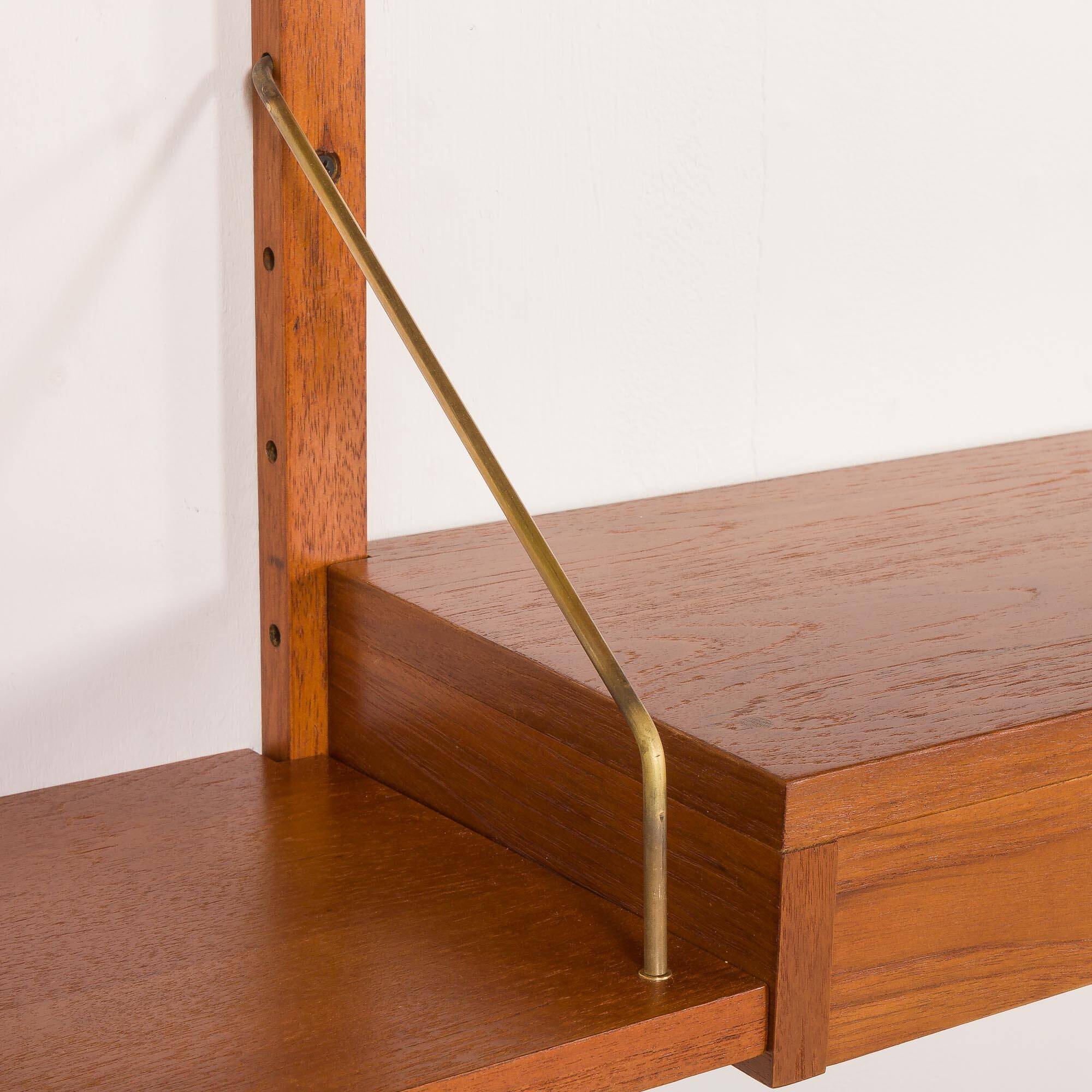 Danish teak wall unit in the style of Cadovius, Sorensen with a lamp, 1970s