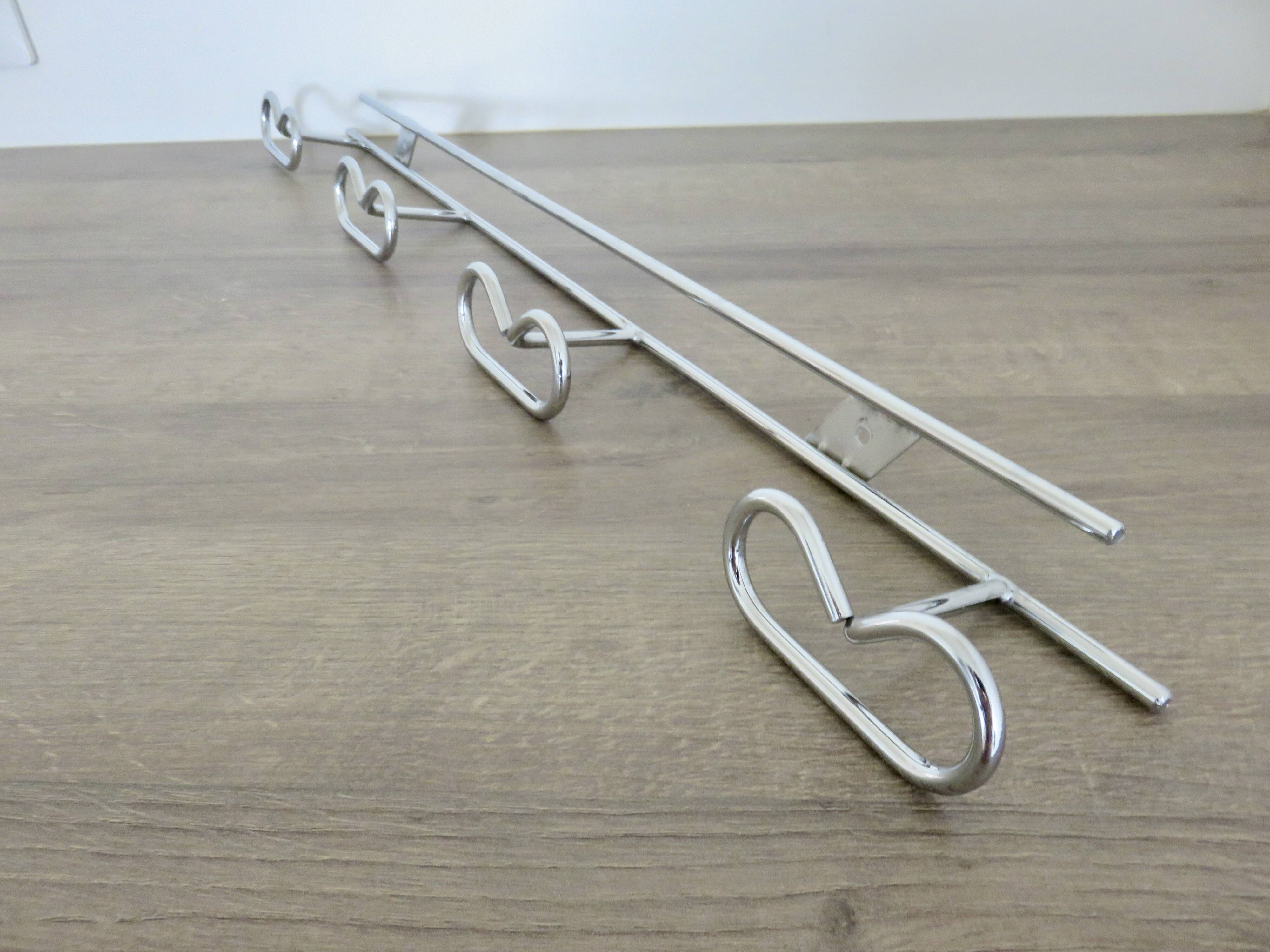 Large vintage wall-mounted coat rack in chrome metal