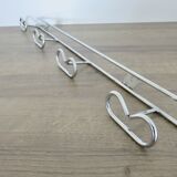 Large vintage wall-mounted coat rack in chrome metal