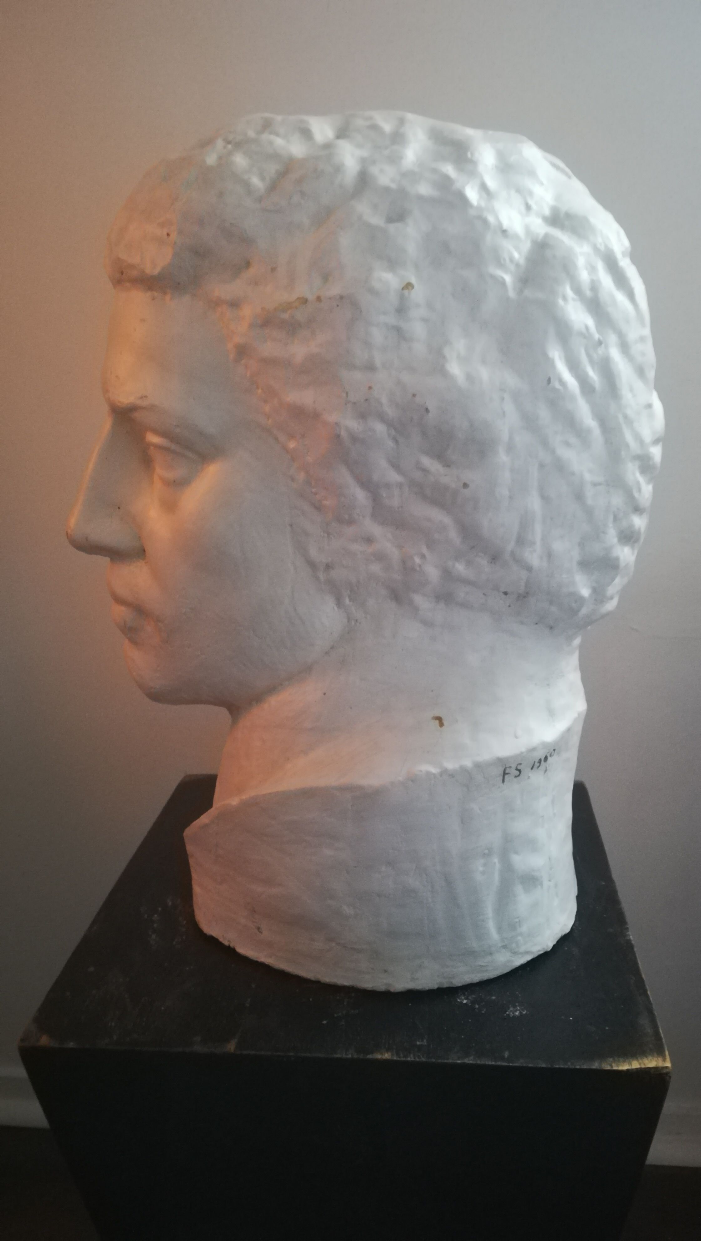 Patinated plaster man head.