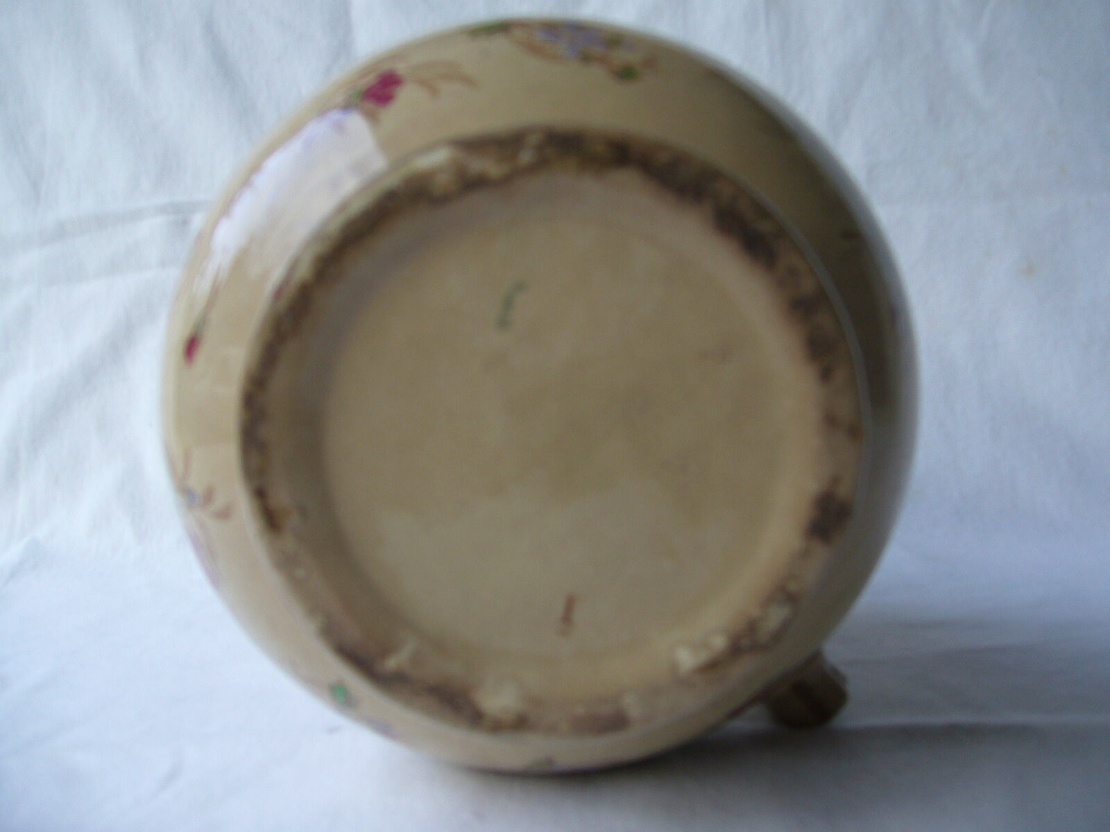 Antique pitcher decorated with flowers