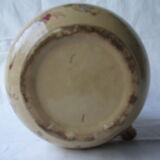 Antique pitcher decorated with flowers