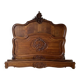 Antique carved bed in Louis XV style made of wood.