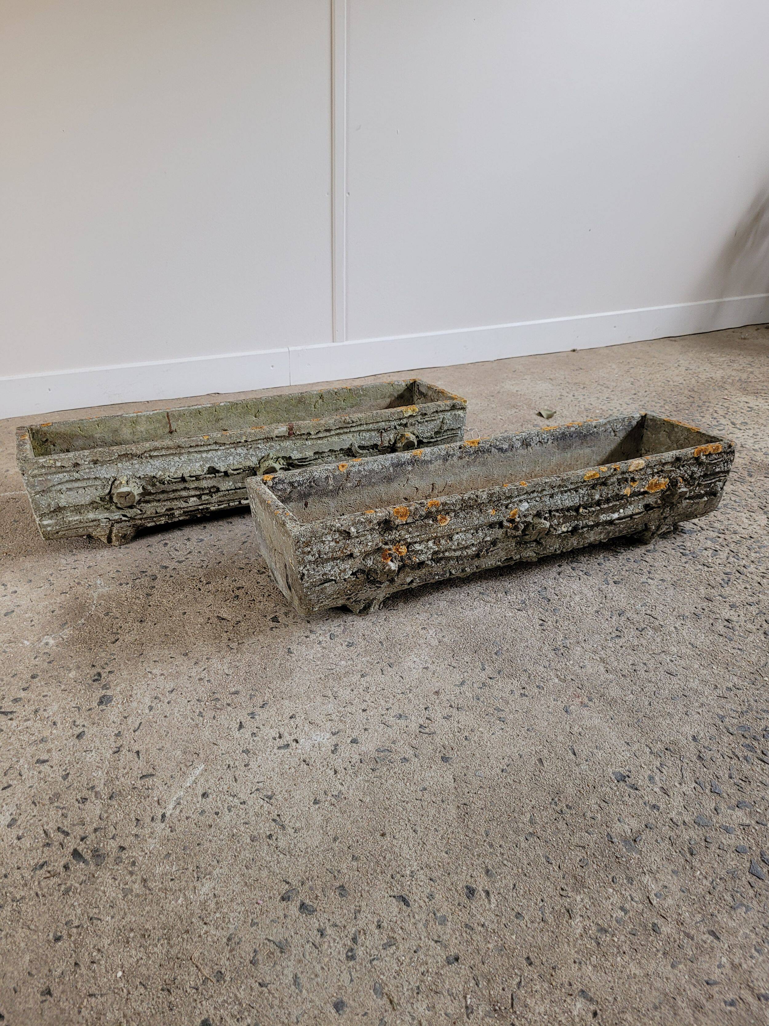 Old planters in faux cement wood