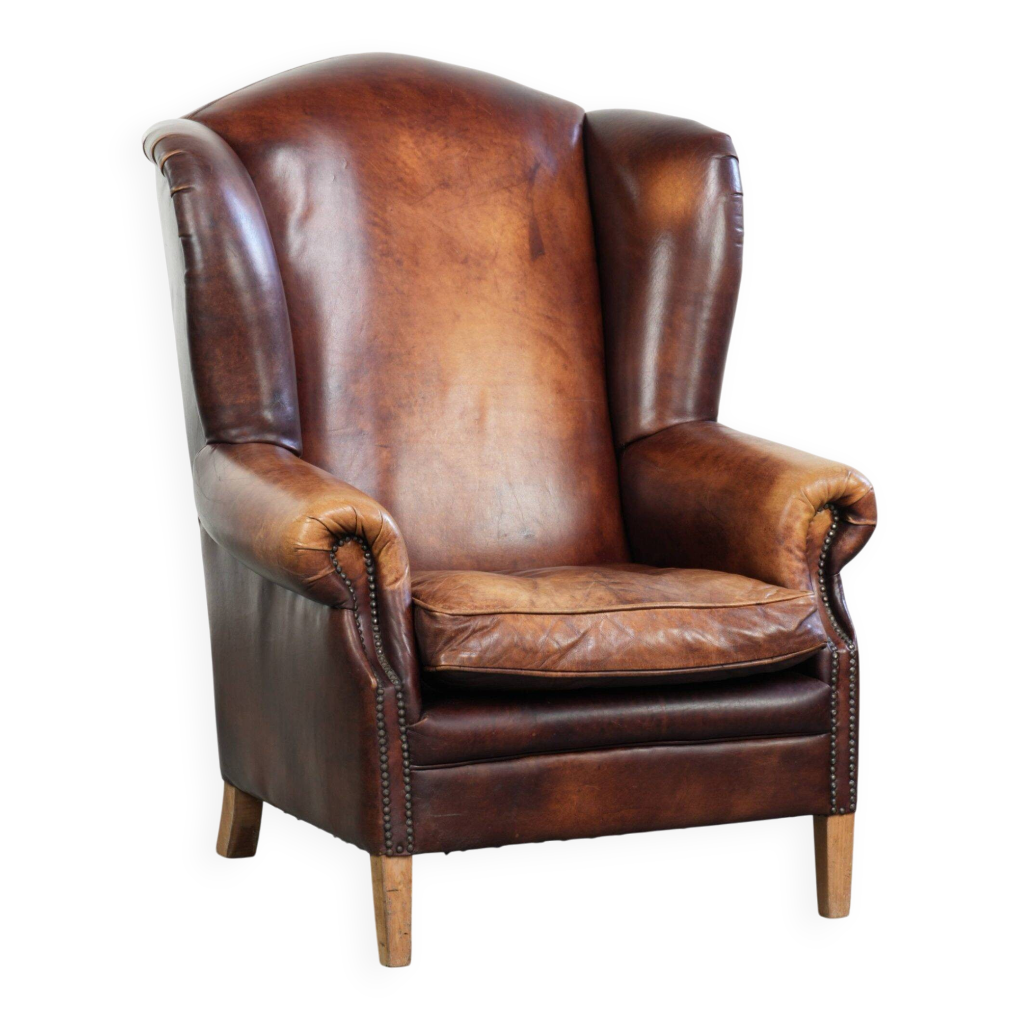 Comfortable cowhide wingback armchair in English style
