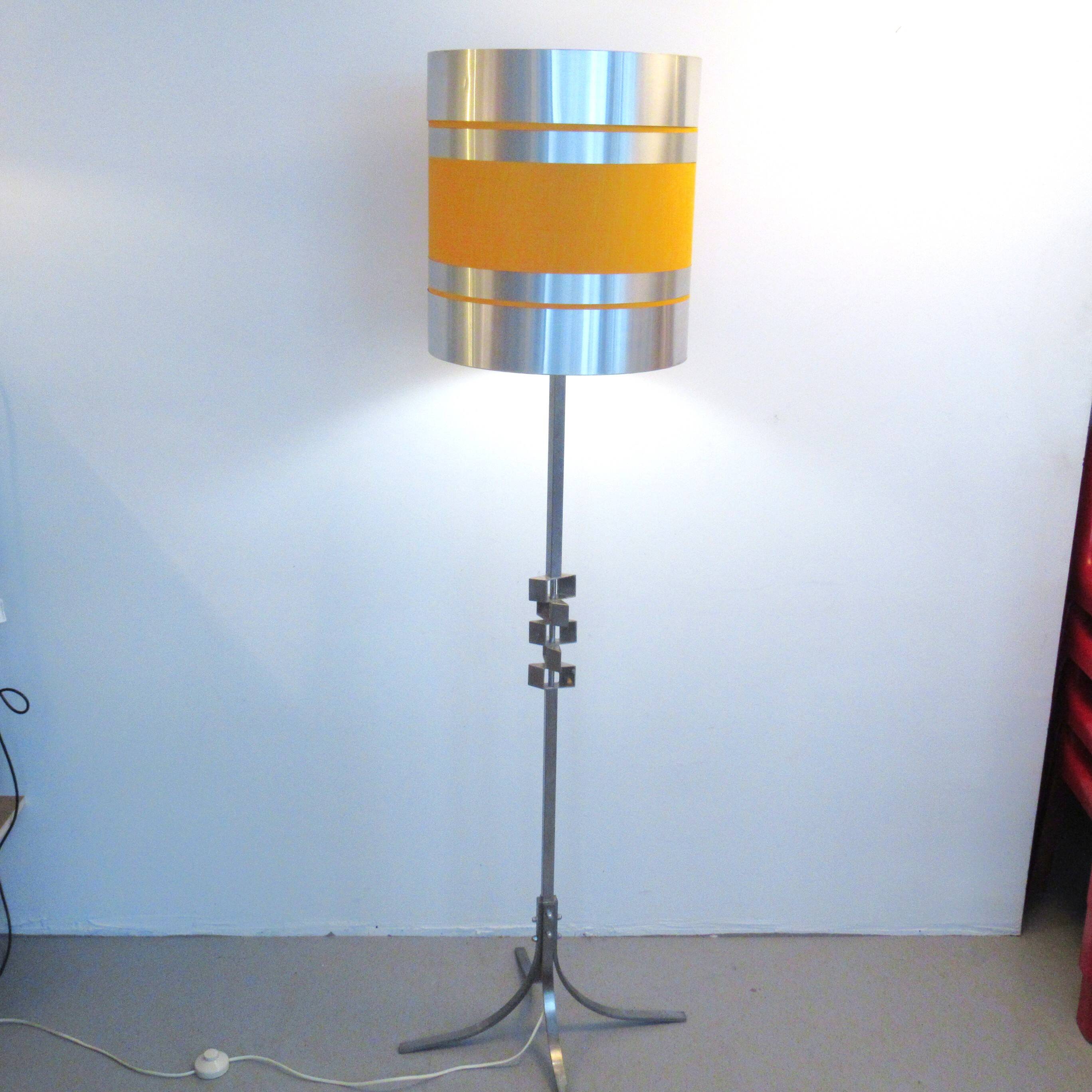 Floor lamp with a large orange shade and metal from the 1960s.