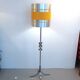 Floor lamp with a large orange shade and metal from the 1960s.