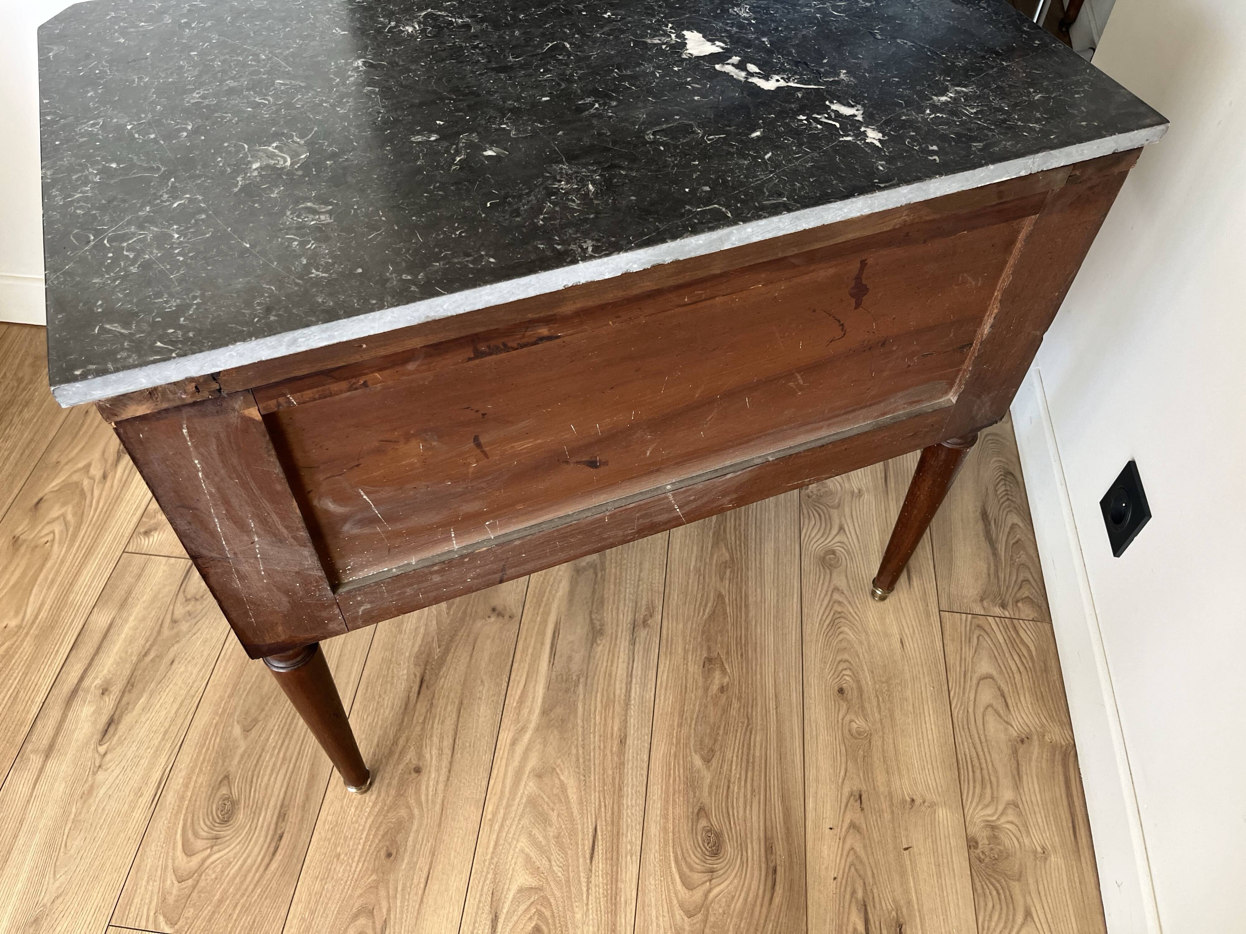 Louis XVI style wooden veneered chest of drawers with a marble top.