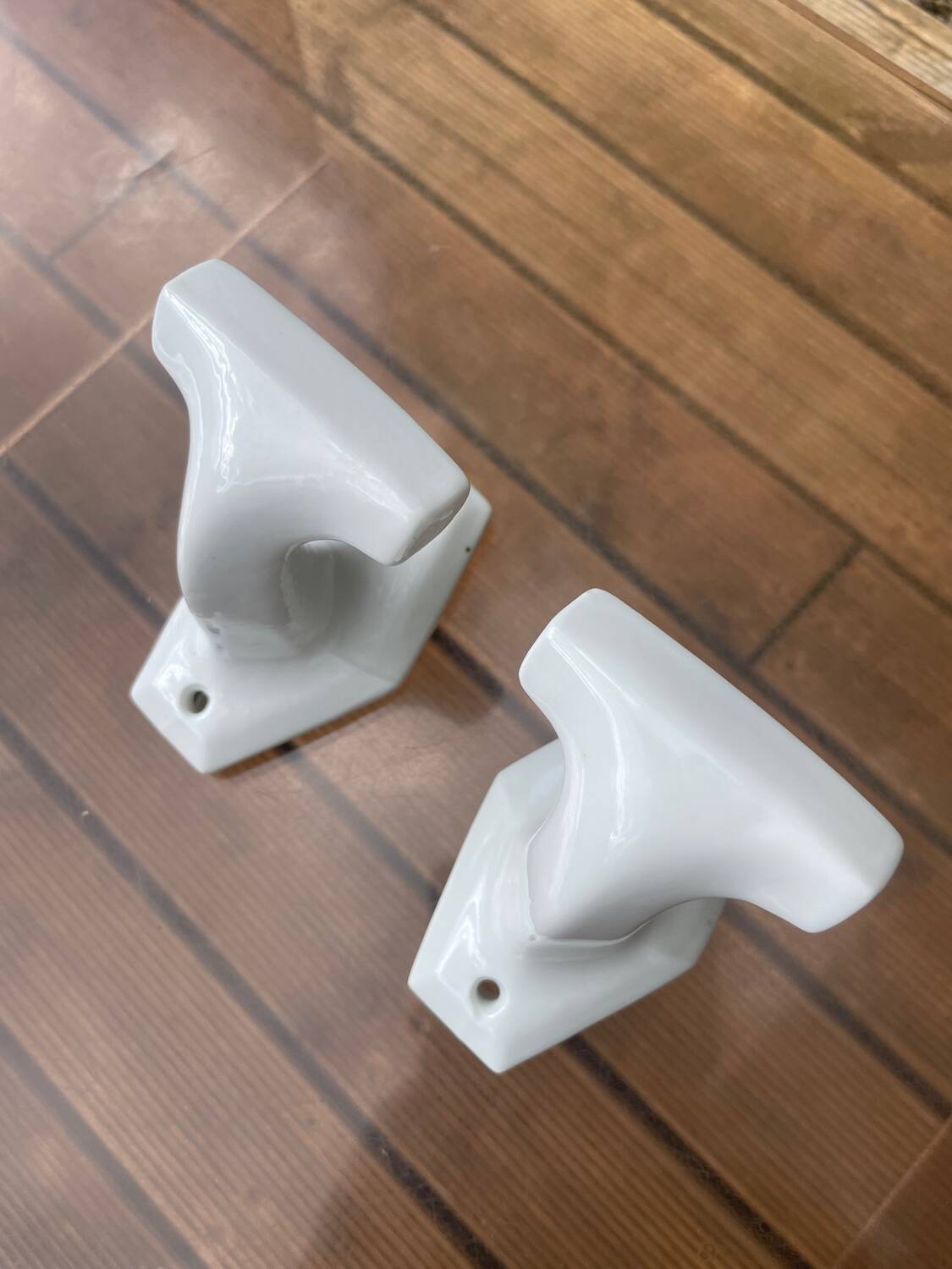 Duo of porcelain hooks