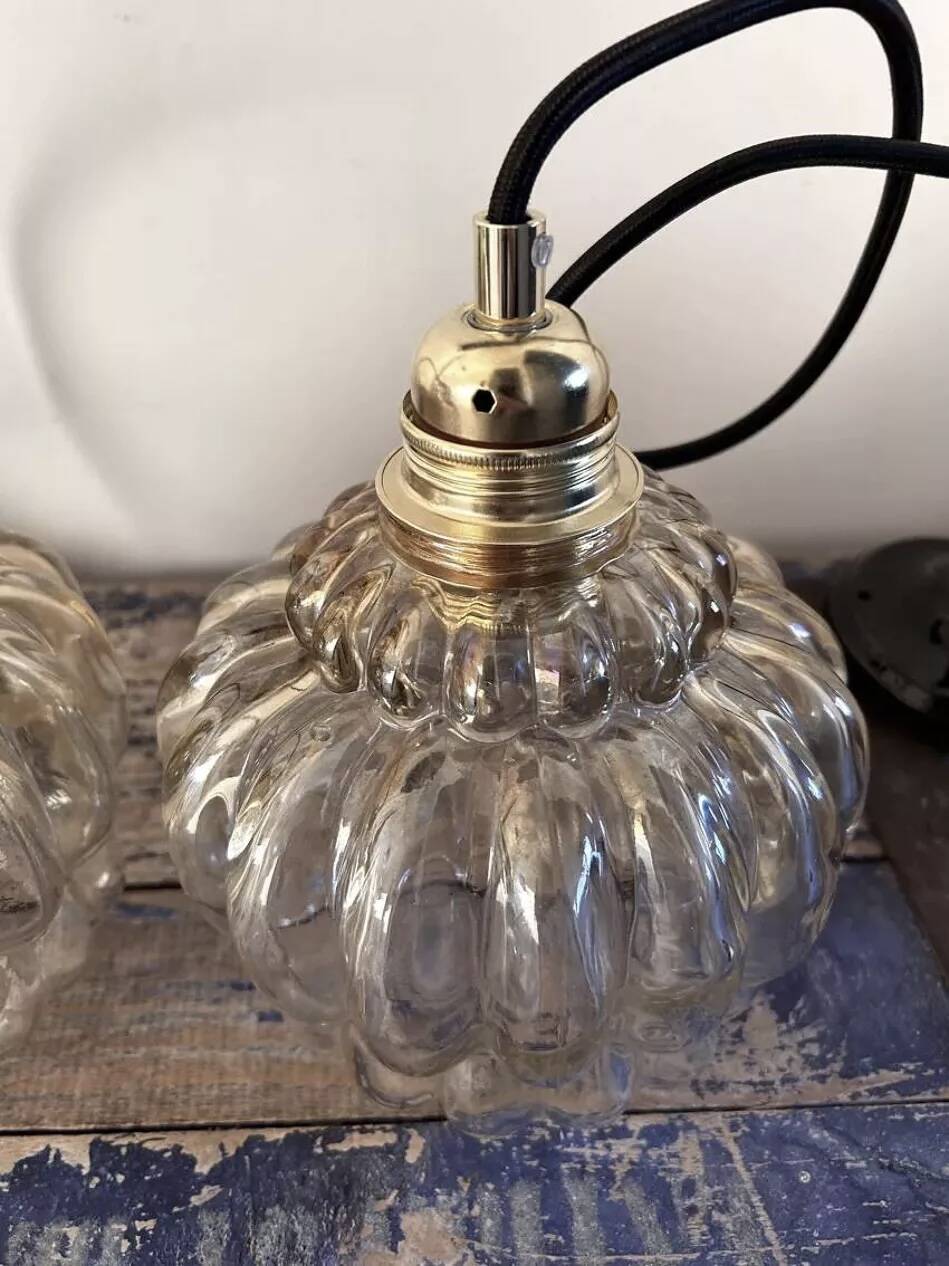 Set of two amber glass pendant lights