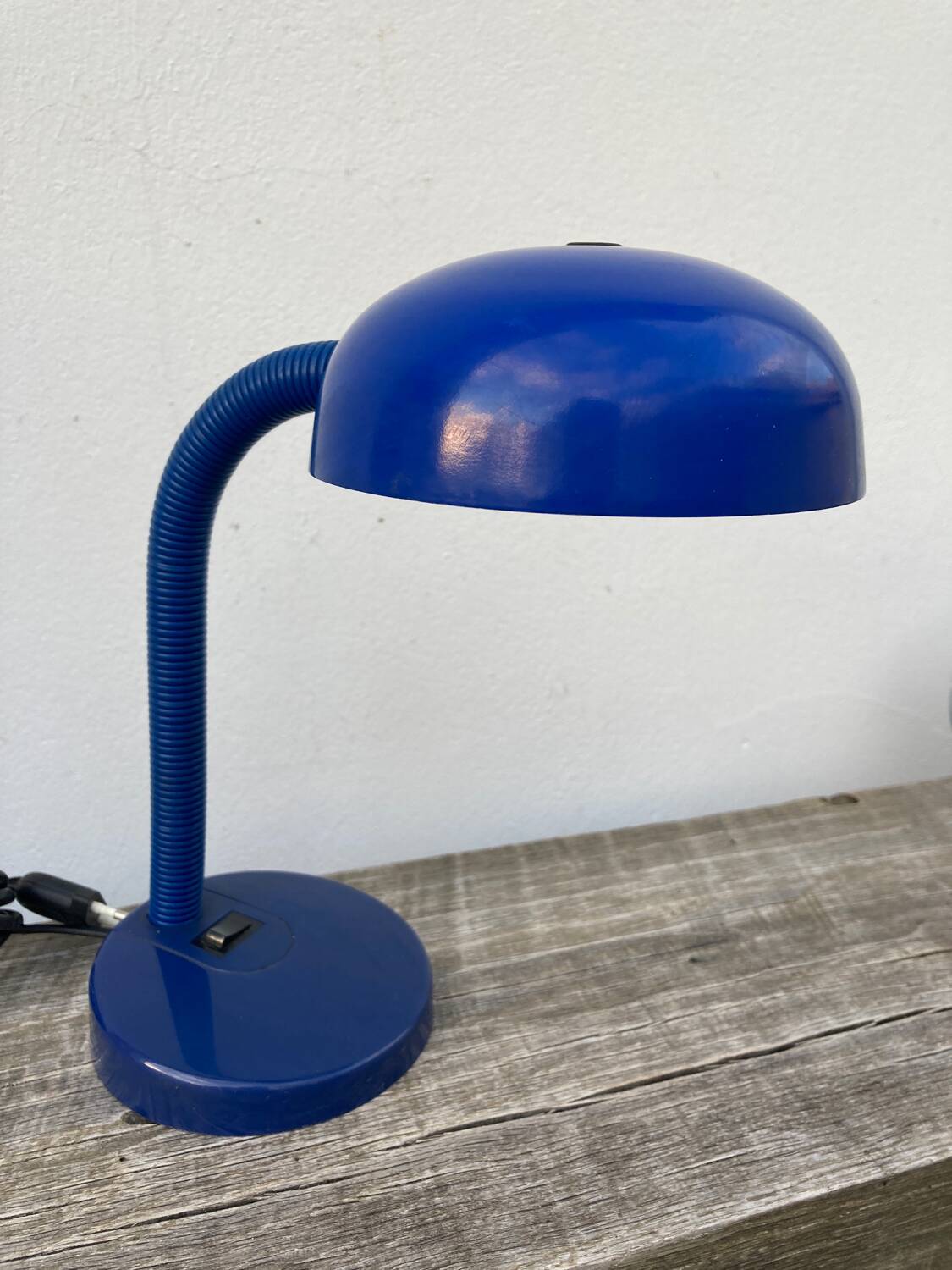 Articulated blue metal bedside lamp