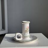 Small vintage hand-held candlestick in earthenware with green trim and floral decoration H10.5