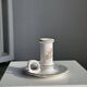 Small vintage hand-held candlestick in earthenware with green trim and floral decoration H10.5