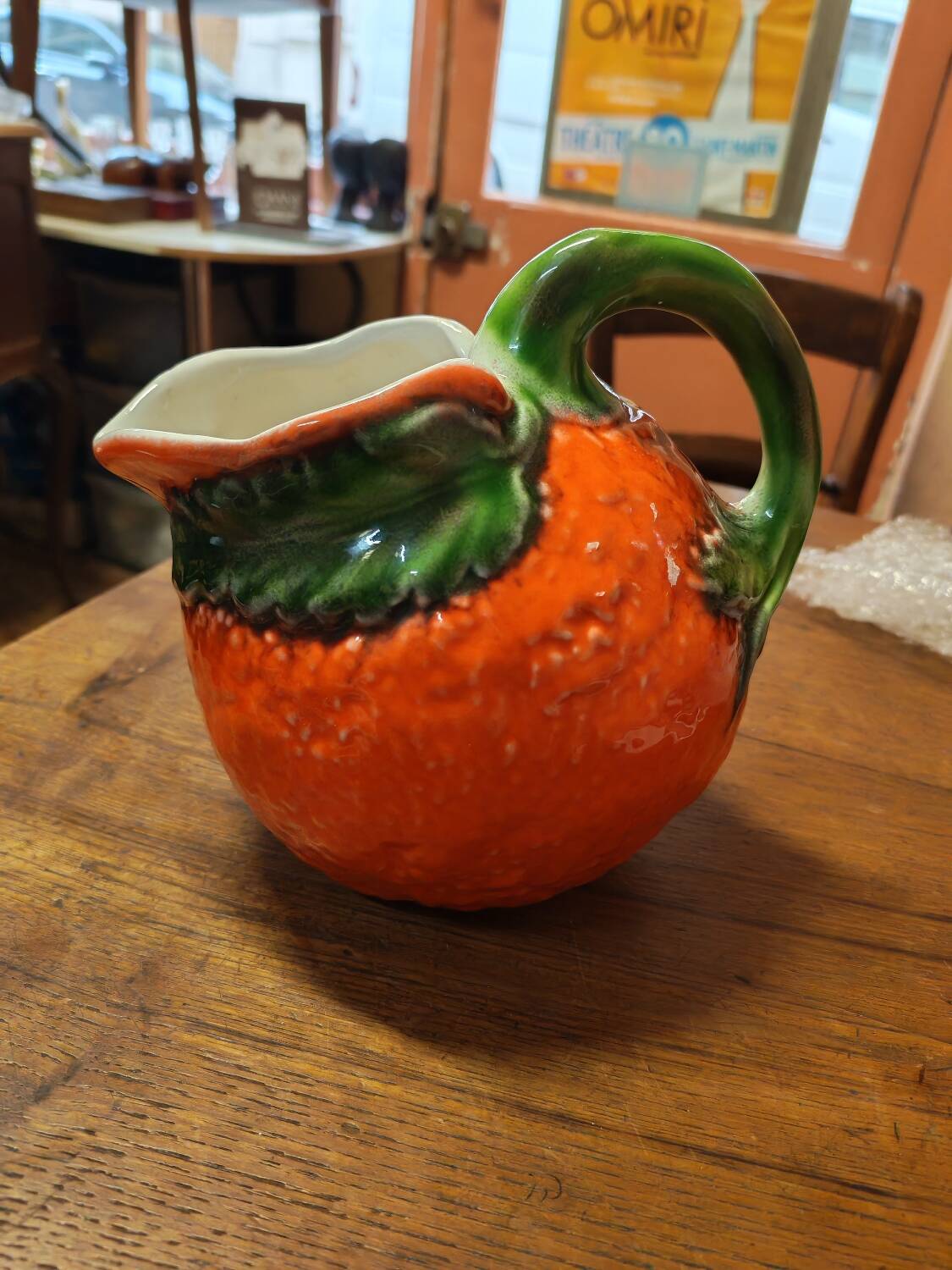 Orange slipware pitcher