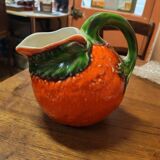 Orange slipware pitcher