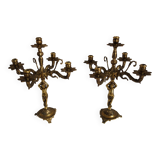 Pair of cherub candle holders in gilded bronze, early 20th century.