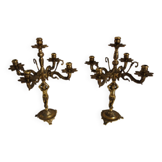 Pair of cherub candle holders in gilded bronze, early 20th century.