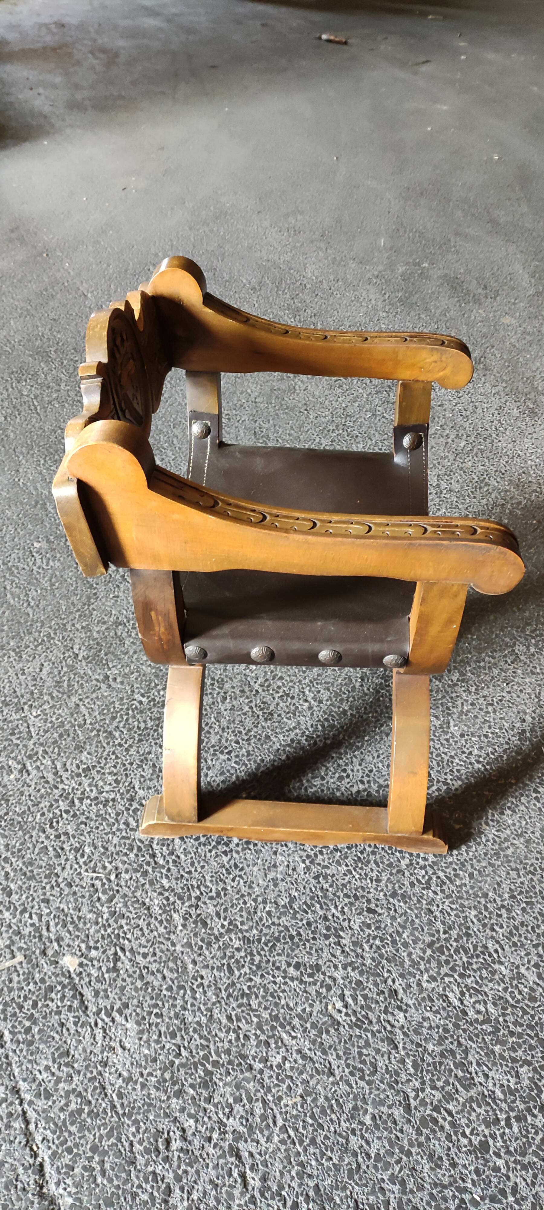 Armchair called Dagobert in wood and leather