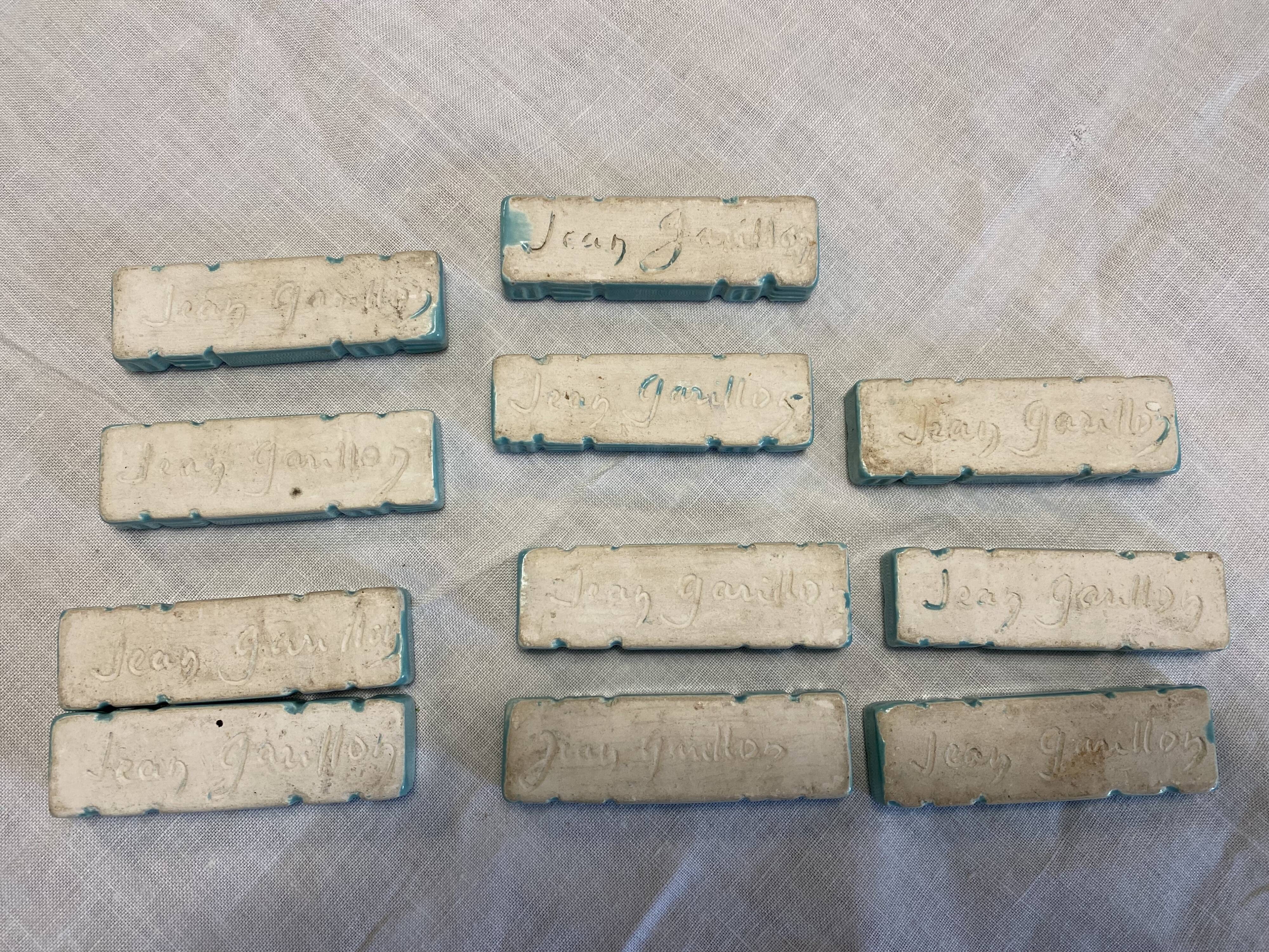 11 ceramic knife holders signed Jean Garillon