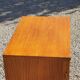 Vintage golden oak sideboard with conical legs from the 1950s