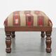 Oriental pouf upholstered in an antique kilim